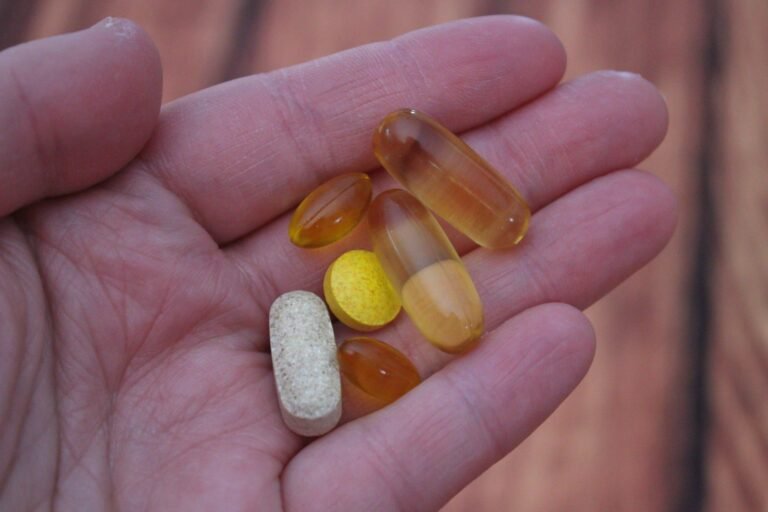 person holding medication pills